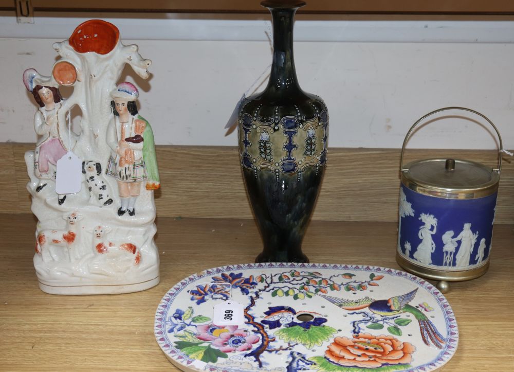 A Stone China strainer, a Staffordshire Highlander group, a Royal Doulton vase and a Wedgwood biscuit barrel (4)